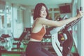 Healthy lifestyle concept,Young teen woman workout with cycling doing cardio training indoor center,Happy and smiling,Close up