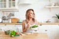 Healthy lifestyle and diet. Healthy young woman eating vegetable salad. Beautiful blonde woman with mixed vegetable at home Royalty Free Stock Photo