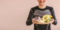 Healthy lifestyle and dieting concept of happy sports man with food