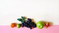 Fruits Grape Citrus Apple Mandarin Lime Green yellow Pink white Background concept still life vegan Eco food m