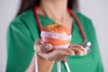 Healthy lifestyle, food and sport concept. Close up Smiling doctor woman hand holding measuring tape around fresh green apple Royalty Free Stock Photo