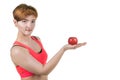 Healthy lifestyle, healthy eating. Young girl holds a red apple on her hand, on a white isolated background. Horizontal frame Royalty Free Stock Photo