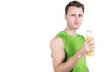 Healthy lifestyle. Portrait of a handsome guy with juice, wearing sportswear, isolated on white background, looking at camera. Hor Royalty Free Stock Photo