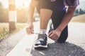 Healthy lifestyle, Runner tying running shoes getting ready for Royalty Free Stock Photo