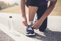 Healthy lifestyle, Runner tying running shoes getting ready for Royalty Free Stock Photo