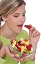 Healthy lifestyle series - Woman biting strawberry Royalty Free Stock Photo