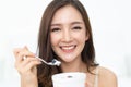 Healthy Lifestyle. Smiling happy young Asian woman eating with f Royalty Free Stock Photo