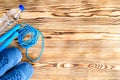 Healthy lifestyle and sport background. Sport shoes, skipping rope and bottle of water on the wooden background with copyspace, t Royalty Free Stock Photo