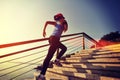 Healthy lifestyle sports woman running up on stone stairs Royalty Free Stock Photo