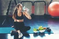 Healthy lifestyle woman drink water at fitness gym. Young people girl workout exercise body for diet and slim health.