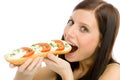 Healthy lifestyle - woman eat caprese sandwich Royalty Free Stock Photo