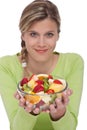 Healthy lifestyle - Woman holding fruit salad Royalty Free Stock Photo