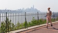 Healthy lifestyle. Woman is jogging on Hamilton ave by Hamilton park, New Jersey. Manhattan of New York City in the Royalty Free Stock Photo