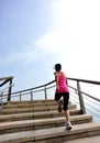 Healthy lifestyle woman legs running on stone stai Royalty Free Stock Photo