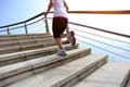 Healthy lifestyle woman legs running on stone stai Royalty Free Stock Photo