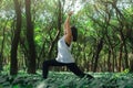 Healthy lifestyle for women practicing meditation and yoga in the forest. Young woman practicing yoga outdoors. Meditation concept Royalty Free Stock Photo