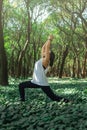 Healthy lifestyle for women practicing meditation and yoga in the forest. Young woman practicing yoga outdoors. Meditation concept Royalty Free Stock Photo