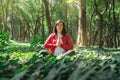 Healthy lifestyle for women practicing meditation and yoga in the forest. Young woman practicing yoga outdoors. Meditation concept Royalty Free Stock Photo