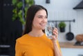 Healthy lifestyle Young smiling caucasian woman holding a glass of clean fresh water Royalty Free Stock Photo