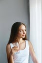 Healthy lifestyle.Young woman drinking from a glass of fresh water. Healthcare. Drinks. Royalty Free Stock Photo