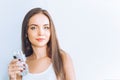 Healthy lifestyle.Young woman drinking from a glass of  fresh water. Healthcare. Drinks. Portrait of happy smiling female model ho Royalty Free Stock Photo