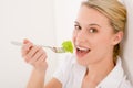 Healthy lifestyle - young woman with lettuce
