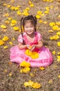 Healthy Little cute girl in pink dress with yellow flowers. Royalty Free Stock Photo