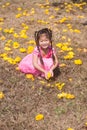 Healthy Little cute girl in pink dress with yellow flowers. Royalty Free Stock Photo