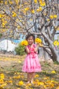 Healthy Little cute girl in pink dress with yellow flowers. Royalty Free Stock Photo