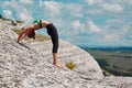 Healthy living. Sport time. Yoga. Woman trains on fresh air. Comfy sportswear. Stunning view from mountain. Copy space Royalty Free Stock Photo