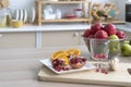 Healthy living and Vegan food. The fruits on the kitchen table were pomegranates, lemons, oranges, and apples Royalty Free Stock Photo