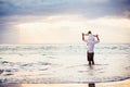 Healthy loving father and daughter playing together at the beach Royalty Free Stock Photo