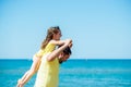 Healthy loving father and daughter playing together at the sea beach. Happy fun smiling lifestyle. Family vacation at Royalty Free Stock Photo