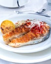 Healthy lunch bowl with grilled salmon, quinoa, and vegetables. Delicious salmon steak on table served with quinoa. Royalty Free Stock Photo