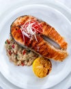 Healthy lunch bowl with grilled salmon, quinoa, and vegetables. Delicious salmon steak on table served with quinoa. Royalty Free Stock Photo