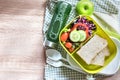 The Healthy Lunch box with grain bread and green vegetable and f