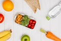 Healthy lunch box with sandwich and fresh vegetables, bottle of Royalty Free Stock Photo