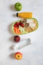 Healthy lunch box with sandwich and fresh vegetables, fruits, bottle of water and juice. from top view Royalty Free Stock Photo