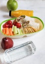 Healthy lunch box with sandwich and fresh vegetables, fruits, bottle of water and juice. from top view Royalty Free Stock Photo