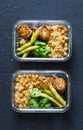 Healthy lunch box - spicy couscous with chickpeas, broccoli, green beans and turkey meatballs on dark background, top view.