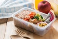 Healthy lunch boxes in plastic package, Grilled chicken breast with broccoli, tomato and passion fruit, dragon fruit. Diet food Royalty Free Stock Photo