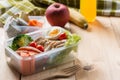 Healthy lunch boxes in plastic package, Grilled chicken breast with sweet potato, egg and vegetable salad, fruit, orange juice. Royalty Free Stock Photo