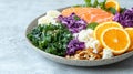 Healthy lunch plate with salmon, kale, cabbage, oranges, and nuts Royalty Free Stock Photo