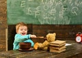 Healthy lunch in school cafeteria. Little child share healthy lunch with toy friend. Boy enjoy healthy lunch with teddy Royalty Free Stock Photo