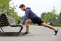 Healthy man doing stretch before jog