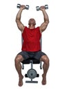 Healthy man lifting dumbbells while sitting on bench press Royalty Free Stock Photo