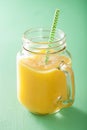 Healthy mango pineapple smoothie in mason jars