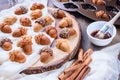 Healthy Maple Acorn Cakelets, acorn shape cookies on wood slice serving board, tray.