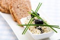 Healthy meal of feta cheese, bread and olives