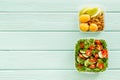 Healthy meal in lunch box to take away on mint green wooden background top view mockup Royalty Free Stock Photo